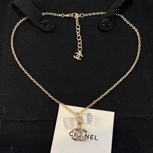 CHANEL Jewelry - CHANEL Bow Pendant Necklace – Clear Crystal & Gold Chain